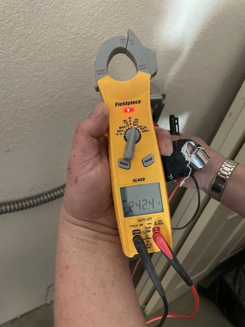 Voltage testing with clamp meter during Circuit Breaker Repair in Grosse Pointe Park